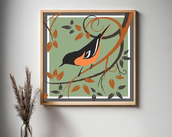 May include: A framed illustration of a black and orange bird perched on a branch with green leaves. The background is a light green color.