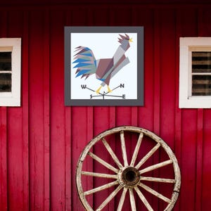 May include: A geometric rooster weather vane with a gray, blue, and brown color scheme. The vane is mounted on a red barn with a white wooden wheel.