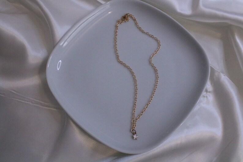 small dainty gold white star necklace