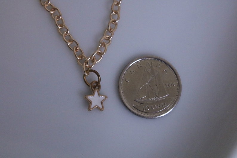 small dainty gold white star necklace