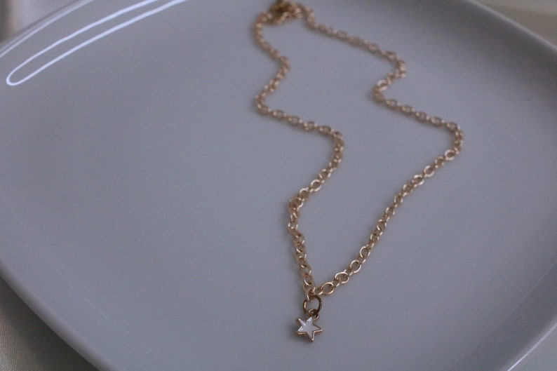 small dainty gold white star necklace