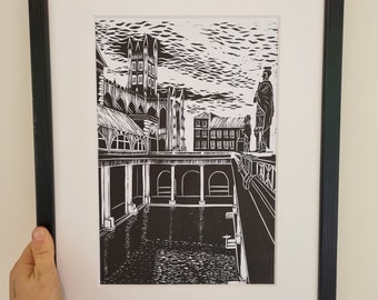 May include: Black and white linocut print of a building with a pool in front of it. The building has a tall tower and a series of arches. The pool is surrounded by a walkway and there are people standing on the walkway.