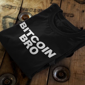 May include: Black t-shirt with the text "BITCOIN BRO" in white letters.