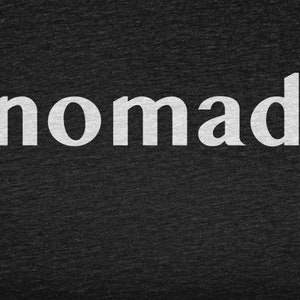 May include: White text on a dark gray background reads "nomad".