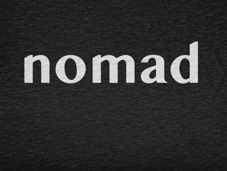 May include: White text on a dark gray background reads "nomad".