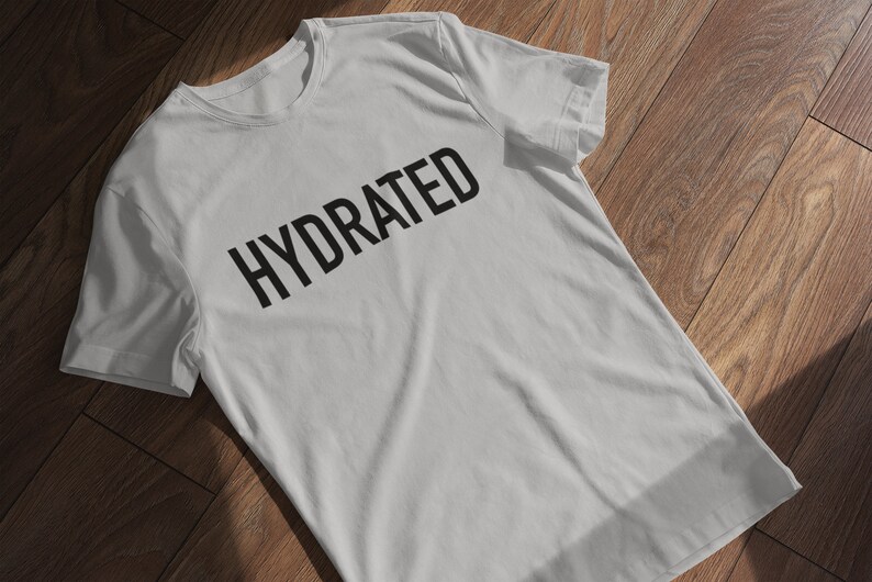 May include: A gray t-shirt with the word "HYDRATED" printed in black on the front.