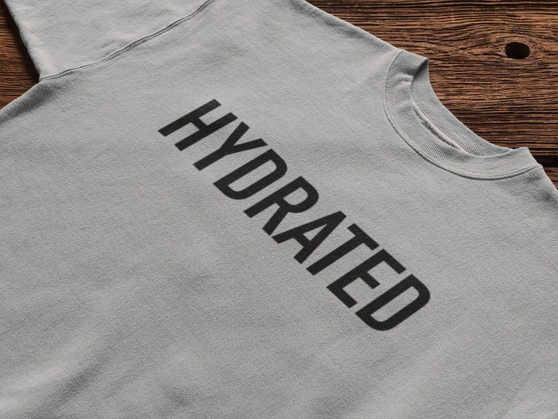 May include: A light gray sweatshirt with the word "HYDRATED" printed in black.