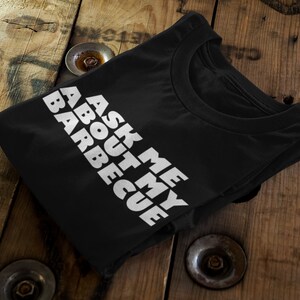 Humorous Barbecue Tee | Ask Me About My BBQ | Grilling Enthusiast Shirt | Pitmaster Gift | Summer Cookout Clothing | Men&#39;s & Women&#39;s T-Shirt