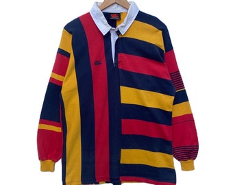 Vintage CANTERBURY Polo Rugby camisa a rayas manga larga streetwear extra grande jersey Nueva Zelanda cuello raya amarillo rojo azul oscuro