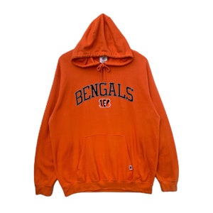 May include: Orange hooded sweatshirt with the word "BENGALS" in black lettering with a tiger logo underneath.