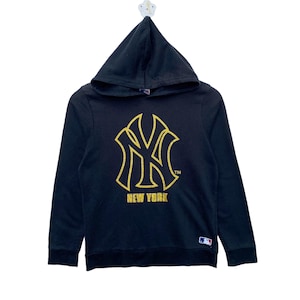 May include: Black hooded sweatshirt with a gold New York Yankees logo and the text "NEW YORK" on the front.