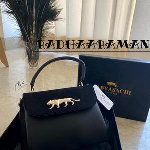 Designer handbag with beautiful logo design, huge space inside, suede fabric with soft touch, women handbag,