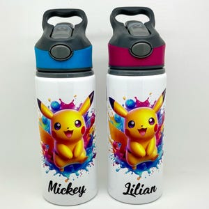May include: Two white water bottles with a Pikachu design and colourful paint splatters. The bottles have grey lids with a carrying handle and a push button. One bottle says "Mickey" and the other says "Lilian".