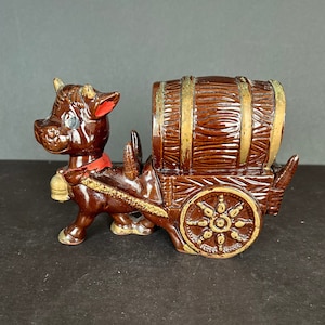 Vintage Japanese Donkey and Cart Decanter. It measures 7 inches long, 2 1/4 inches wide and 5 inches high. No Cups.