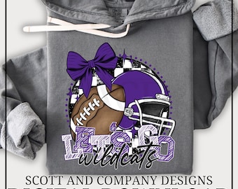 May include: A charcoal gray hooded sweatshirt featuring a graphic print of a brown football, a purple football helmet, and a large purple bow. The text "Let's Go" appears in purple block letters above the script word "wildcats" in black.