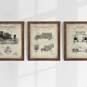 May include: Three vintage patent drawings for automobiles. The drawings are framed in brown wood frames and have a beige background. The first drawing shows a motor for automobiles, the second shows a combined automobile body and hood, and the third shows an automobile.