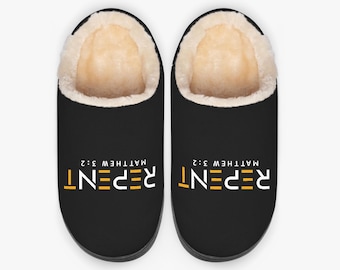 May include: Black slippers with a cream-colored, plush interior. The word "REPENT" is printed in white and yellow, with "MATTHEW 3:2" above it. These cozy slippers are designed for indoor use.