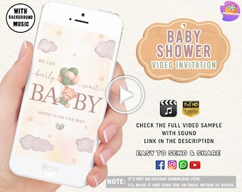 May include: A smartphone screen displaying a baby shower video invitation with a cartoon bear holding balloons. The text on the screen reads "We can barely wait BABY SMITH IS ON THE WAY!" The video is in full HD and includes sound.
