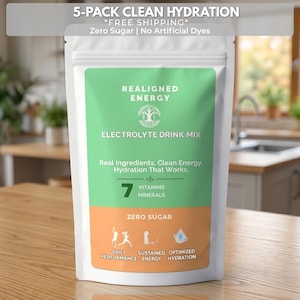 May include: A white pouch of electrolyte drink mix with the text "REALIGNED ENERGY" and "ELECTROLYTE DRINK MIX". The pouch has a green and orange label with the words "Zero Sugar" and "7 Vitamins Minerals". The top of the pouch reads "5-PACK CLEAN HYDRATION".