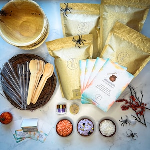 May include: A Halloween-themed party kit with a cauldron, a wand, and a variety of colorful sprinkles. The kit also includes a set of instructions for making a magical potion. The kit is packaged in a brown paper bag with a spider web design.