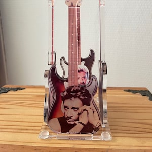 Johnny Hallyday, 4 guitars printed on plexiglass with stand.