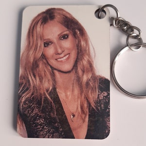 Celine Dion key ring in personalized sublimated linden wood.