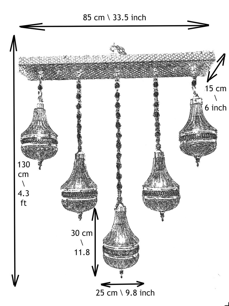 May include: A five-light chandelier with crystal accents. The chandelier is 4.3 feet tall and has a width of 33.5 inches. The chandelier has a chain that is 11.8 inches long and a base that is 9.8 inches wide.