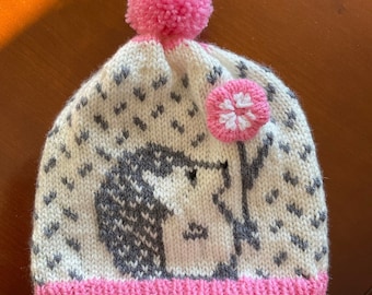 Child’s Hand Knitted Bobble Hat with Hedgehog and Flower