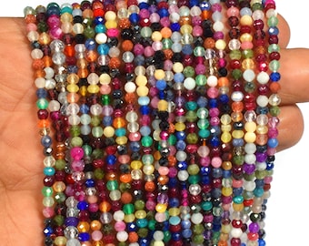 May include: A strand of colorful gemstone beads, featuring a variety of shapes and sizes. The beads are strung on a clear thread and are ready for jewelry making.
