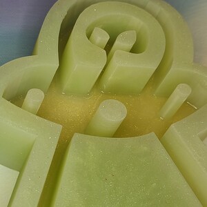 May include: A set of three ceramic mugs with a speckled, matte finish. The mugs are in shades of cream, light gray, and dark gray. Each mug has a simple, minimalist design, perfect for coffee or tea.