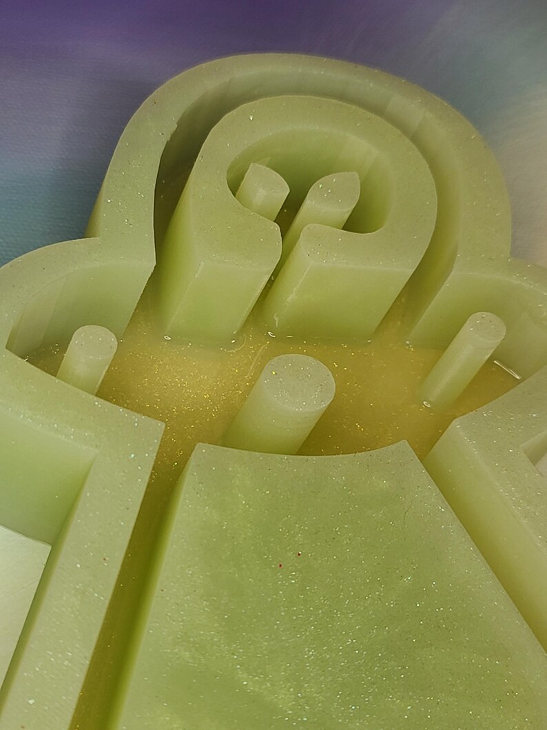 May include: A set of three ceramic mugs with a speckled, matte finish. The mugs are in shades of cream, light gray, and dark gray. Each mug has a simple, minimalist design, perfect for coffee or tea.