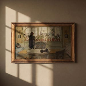 May include: A framed horizontal wall art print depicting an interior scene with a person standing by a window filled with potted plants. The room features a round table, a chair, and a daybed, all rendered in muted tones within a dark wood frame.