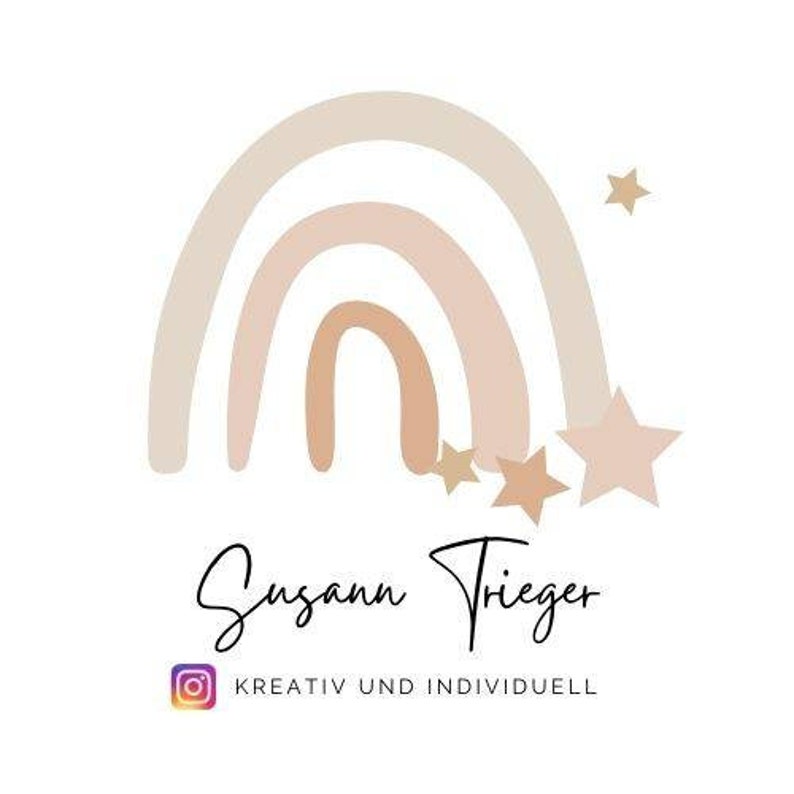 May include: A logo featuring a pastel rainbow with a peach, pink, and beige color scheme. The rainbow is surrounded by small gold stars. The text "Susann Trieger" is written in black cursive script below the rainbow. The text "KREATIV UND INDIVIDUELL" is written in black below the name.