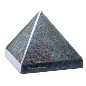 May include: A dark blue, purple, and green gemstone pyramid with a smooth, polished surface.  The pyramid is made of natural stone and has a unique, speckled pattern.  © Amazing Gemstones