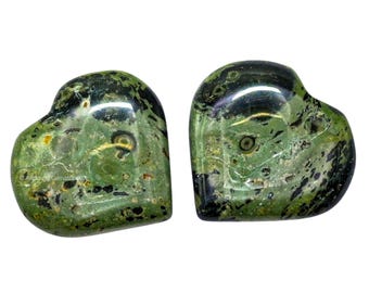 May include: Two heart-shaped stones with a polished, glossy finish. The stones are primarily green with black and yellow inclusions, creating a unique pattern. The heart shapes are smooth and symmetrical, ideal for decorative purposes.