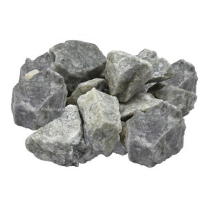 May include: A pile of gray and white tumbled stones. The stones are rough and have a natural, unpolished look.
