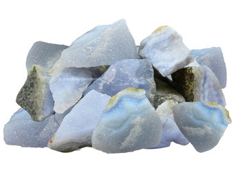May include: A pile of blue lace agate rough stones. The stones are a light blue color with white and gray banding. The stones are irregular in shape and size.