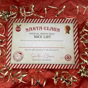 May include: A festive Christmas-themed certificate from Santa Claus, with the text "OFFICIAL NORTH POLE NICE LIST." The certificate is surrounded by gold ribbon and star-shaped ornaments on a red background.