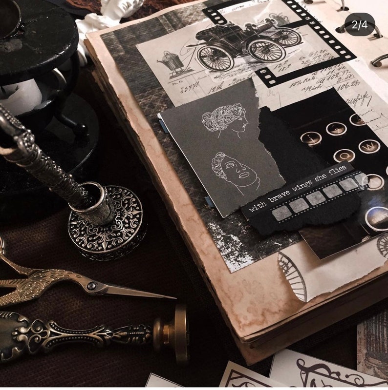 May include: A vintage-style scrapbook with torn paper, illustrations, and handwritten notes. The pages are aged with a sepia tone. A pen holder, scissors, and a wax seal are also visible, suggesting a theme of journaling and ephemera.