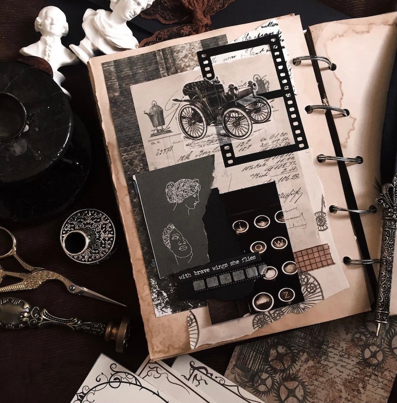 May include: A vintage-themed scrapbook with a collage of images, including an antique car, film strip, and typewriter keys. The pages are aged with a sepia tone, and the text "with brave wings she flies" is visible.