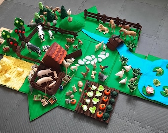 May include: A felt play set for children featuring a farm scene with animals, a house, a river, and a garden. The set includes a variety of farm animals, including cows, pigs, chickens, and ducks. There are also trees, a fence, and a small house. The set is perfect for imaginative play and learning about farm life.