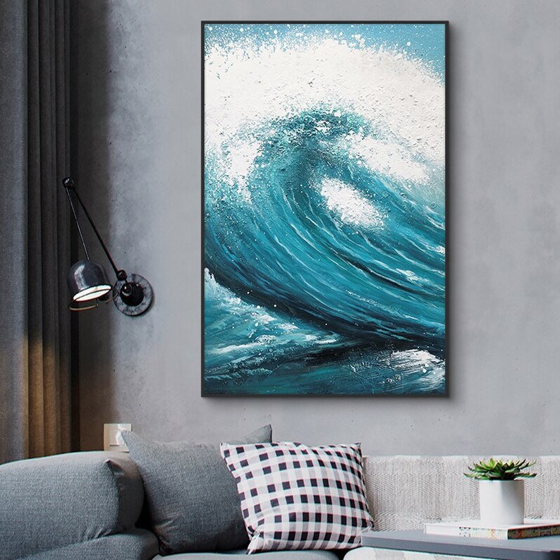 May include: A framed abstract painting of a large blue wave crashing against a white background. The wave is painted with thick brushstrokes and has a textured surface.