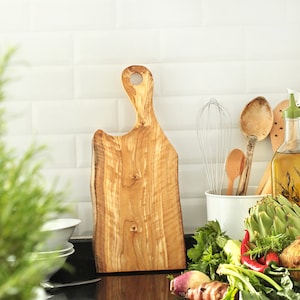 Olive wood chopping board with hole handle.