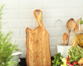 Olive wood chopping board with hole handle.