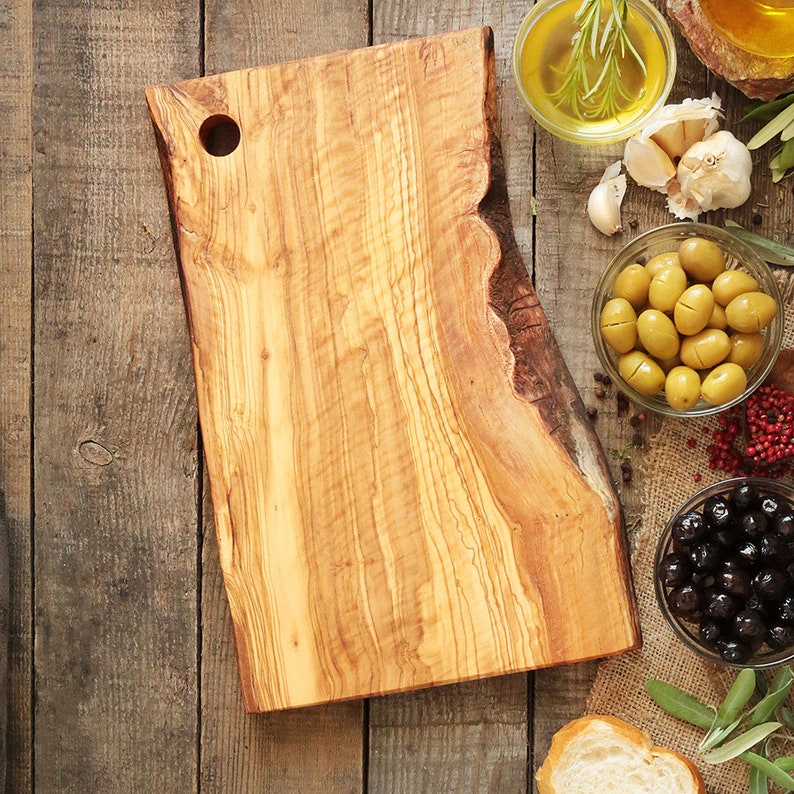 Olive wood cutting board with hole and handle image 1
