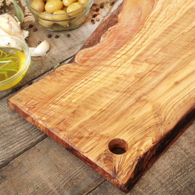 Olive wood cutting board with hole and handle image 4