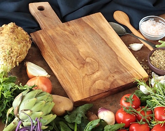 Chopping board made of walnut wood with hole handle