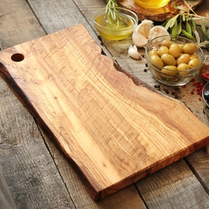 Olive wood cutting board with hole and handle image 2