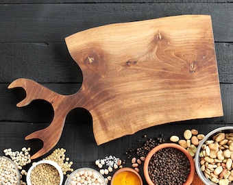 Live edge black walnut cutting board with handle