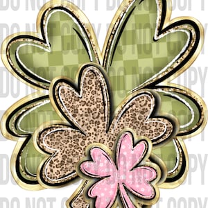 May include: A layered clover design with a gold outline. The top layer is a green checkered pattern, the middle layer is a leopard print, and the bottom layer is pink with a white floral pattern. The design has a black and gold border.